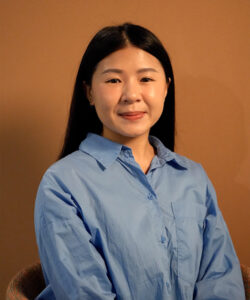 HM, Benel team member, smiling professional portrait