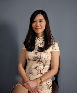 Rynn, Benel team member, smiling professional portrait