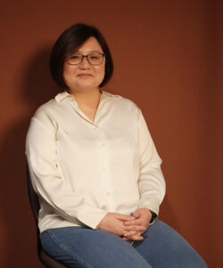 Doreen, Benel team member, smiling professional portrait