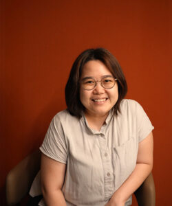 Jessy, Benel team member, smiling professional portrait